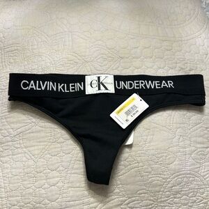 Black Calvin Klein thong, size medium